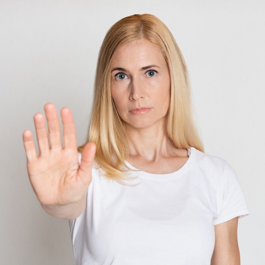 Person gesturing stop